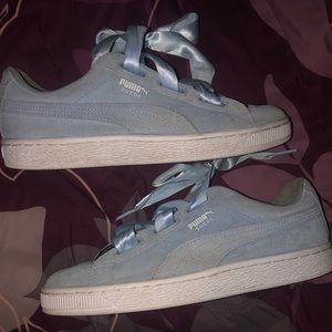 Light blue and white Pumas in a size 6.5